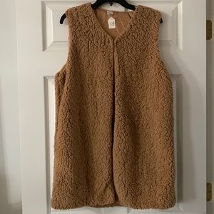 Brand new sherpa vest. Very soft and fuzzy! Hook closure at the top.